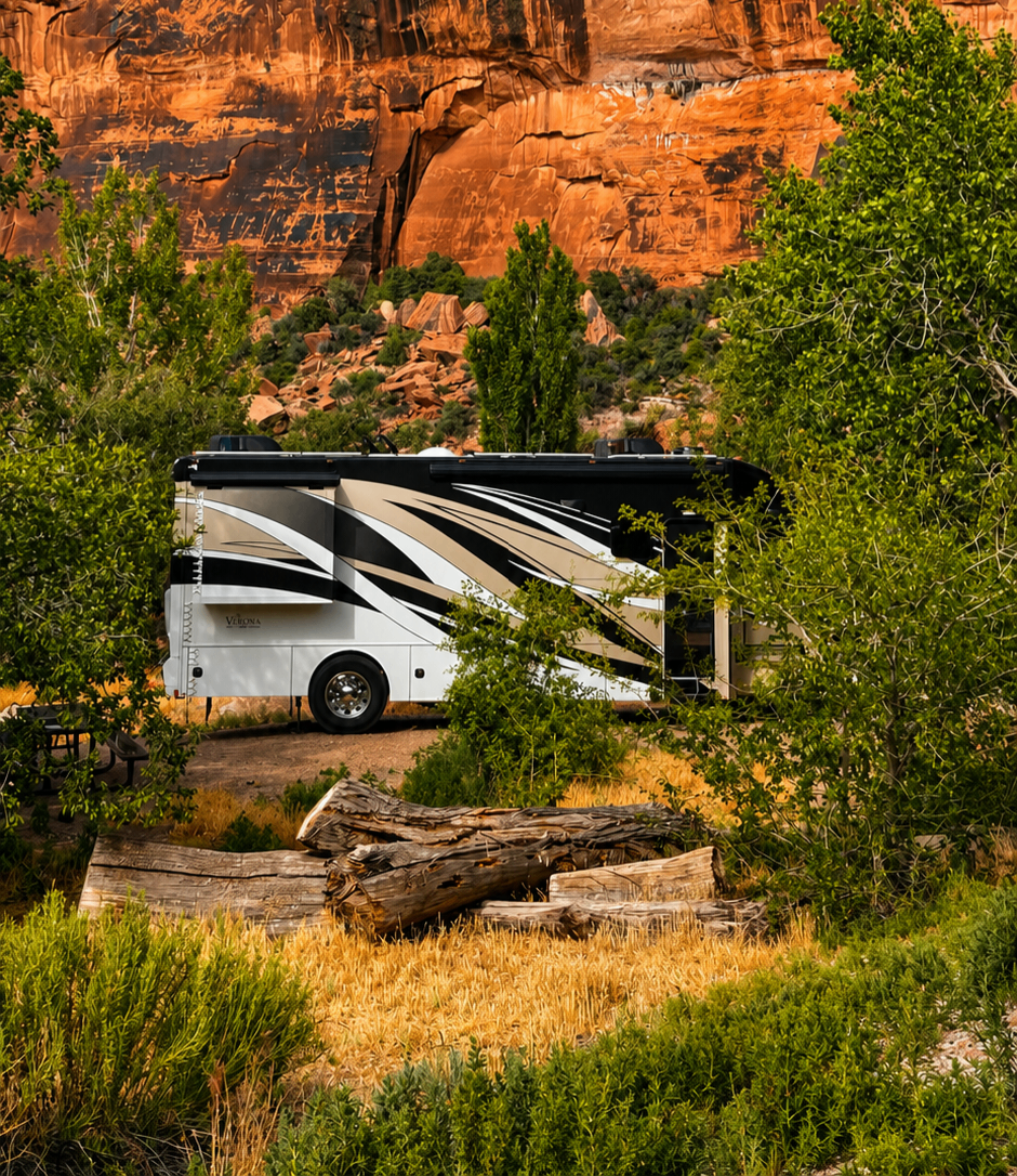 Motorhome camping off-grid beneath red rock cliffs