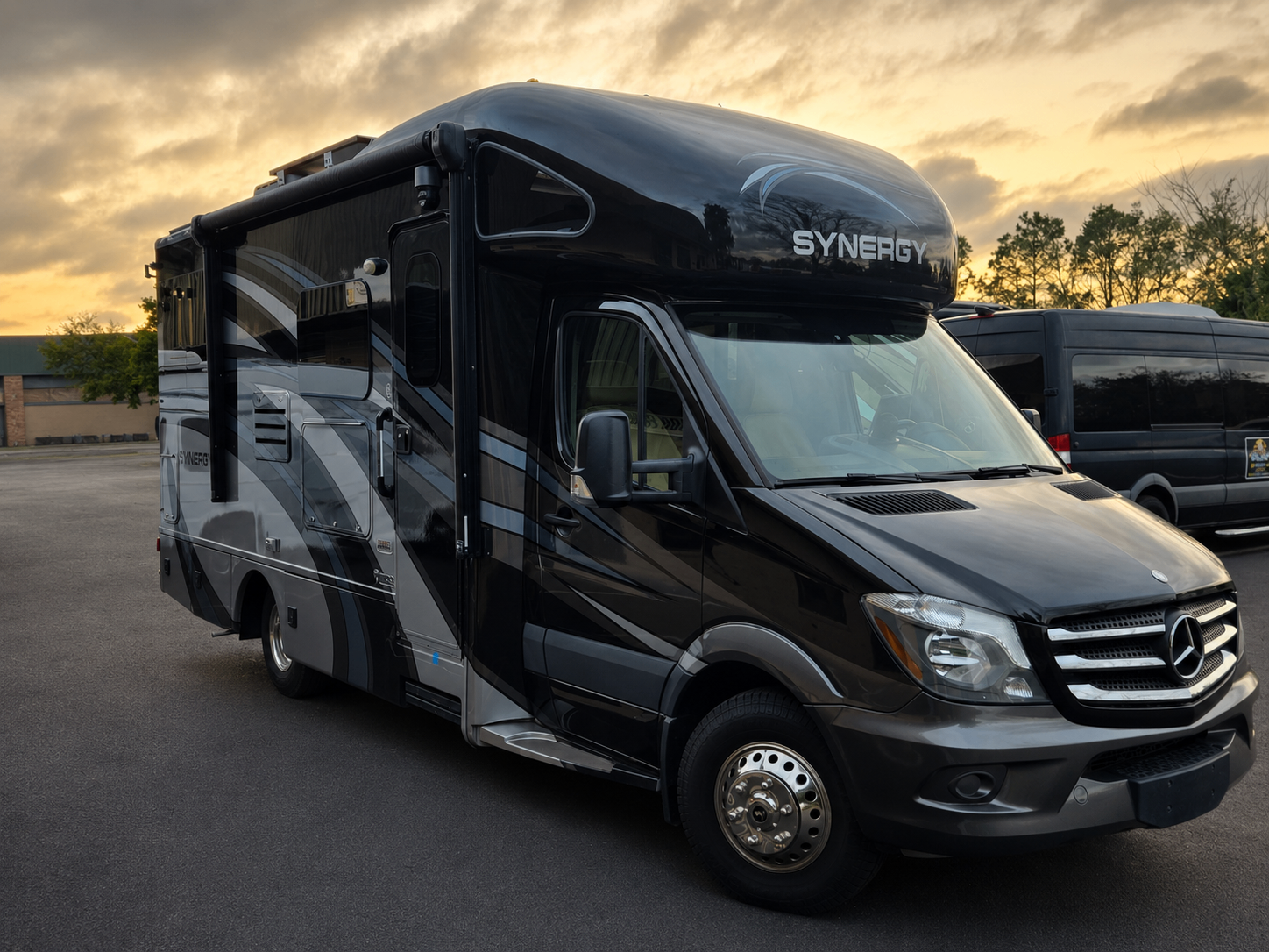 Synergy Class C coach at sunset after solar installation