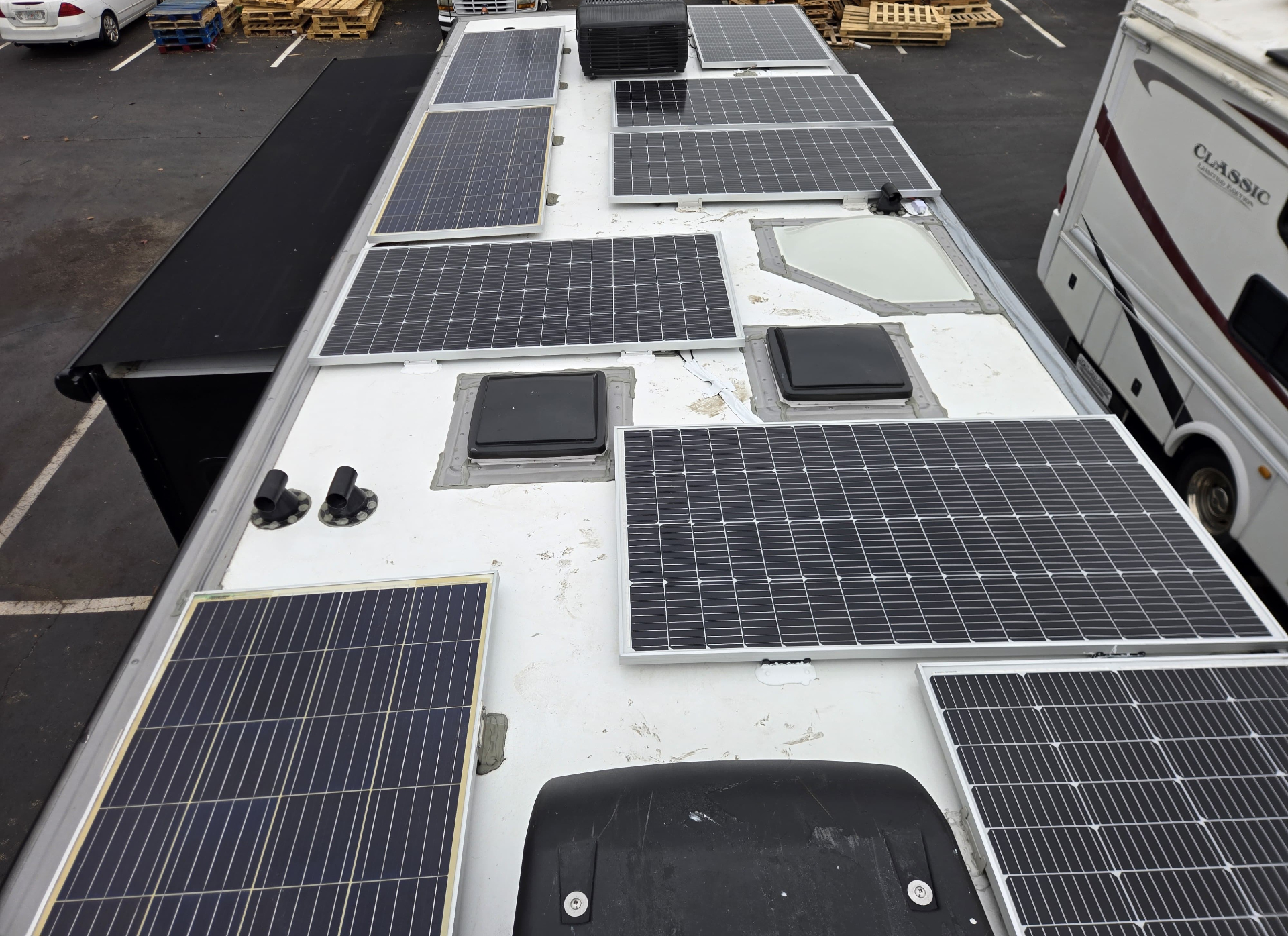 Detailed rooftop solar layout around RV roof vents and skylight